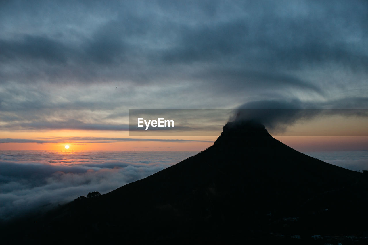 Scenic view of mountains against sky during sunset