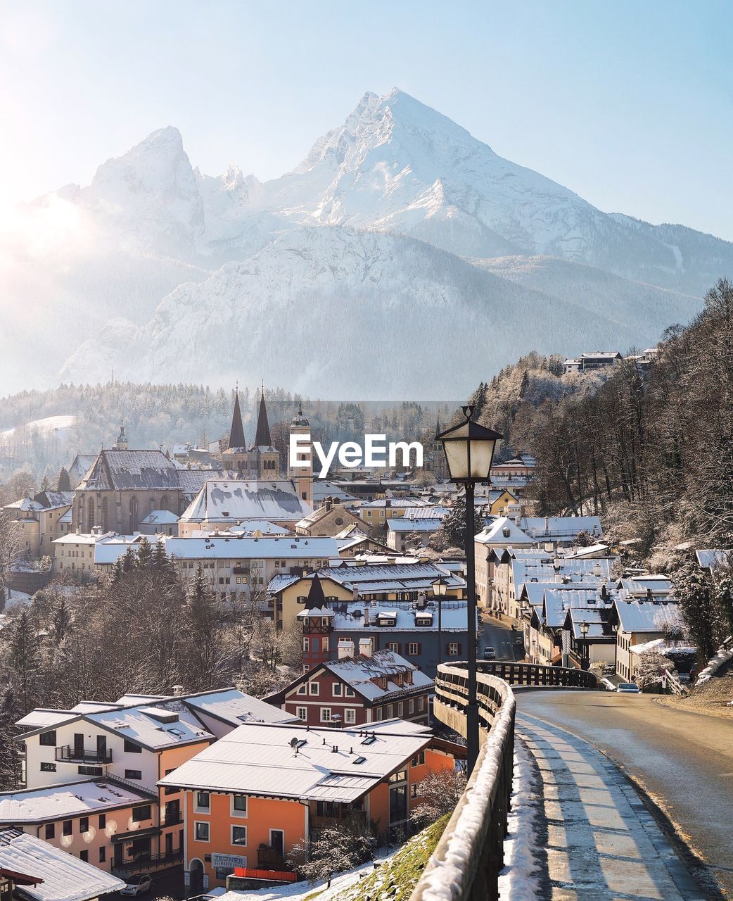 Buildings in city against sky during winter