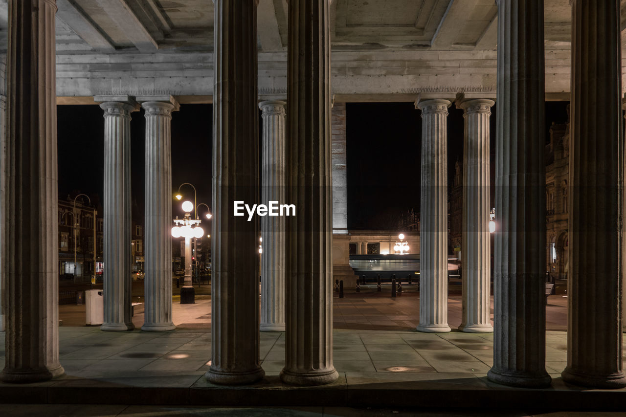 Columns in building at night
