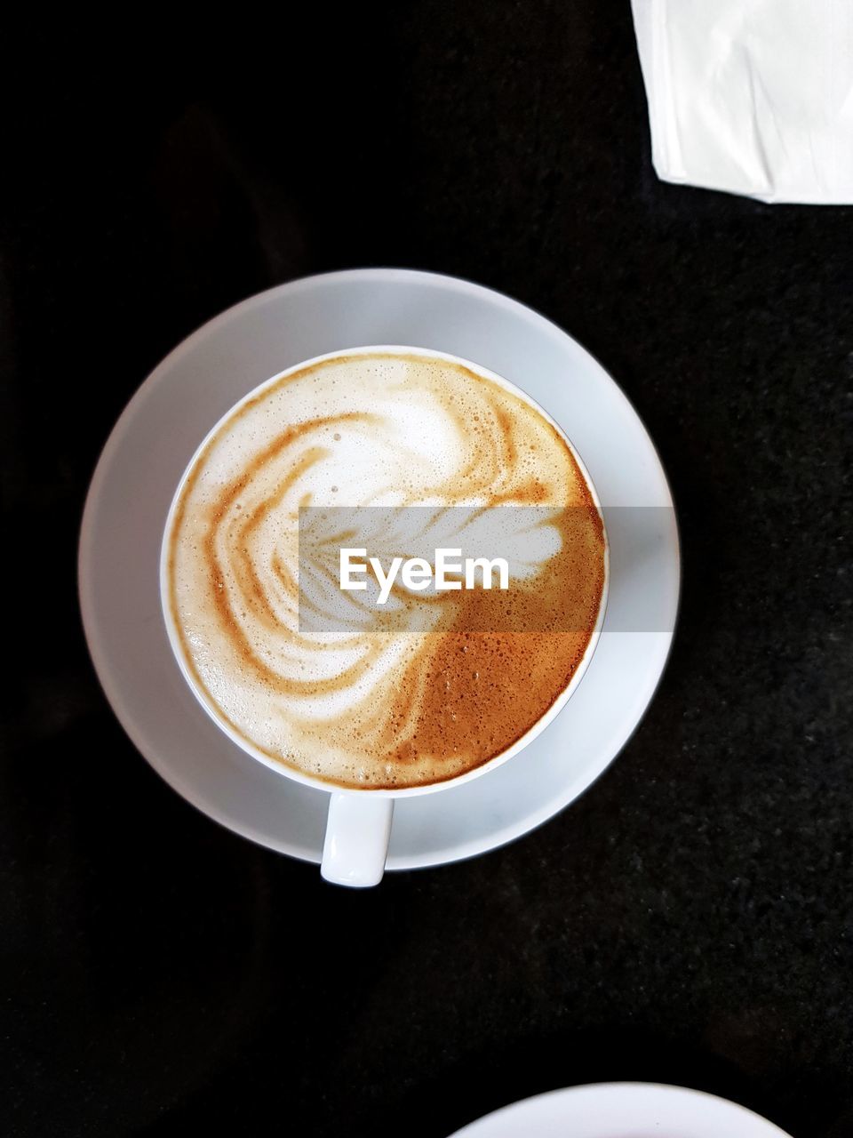 HIGH ANGLE VIEW OF CAPPUCCINO AND COFFEE ON TABLE