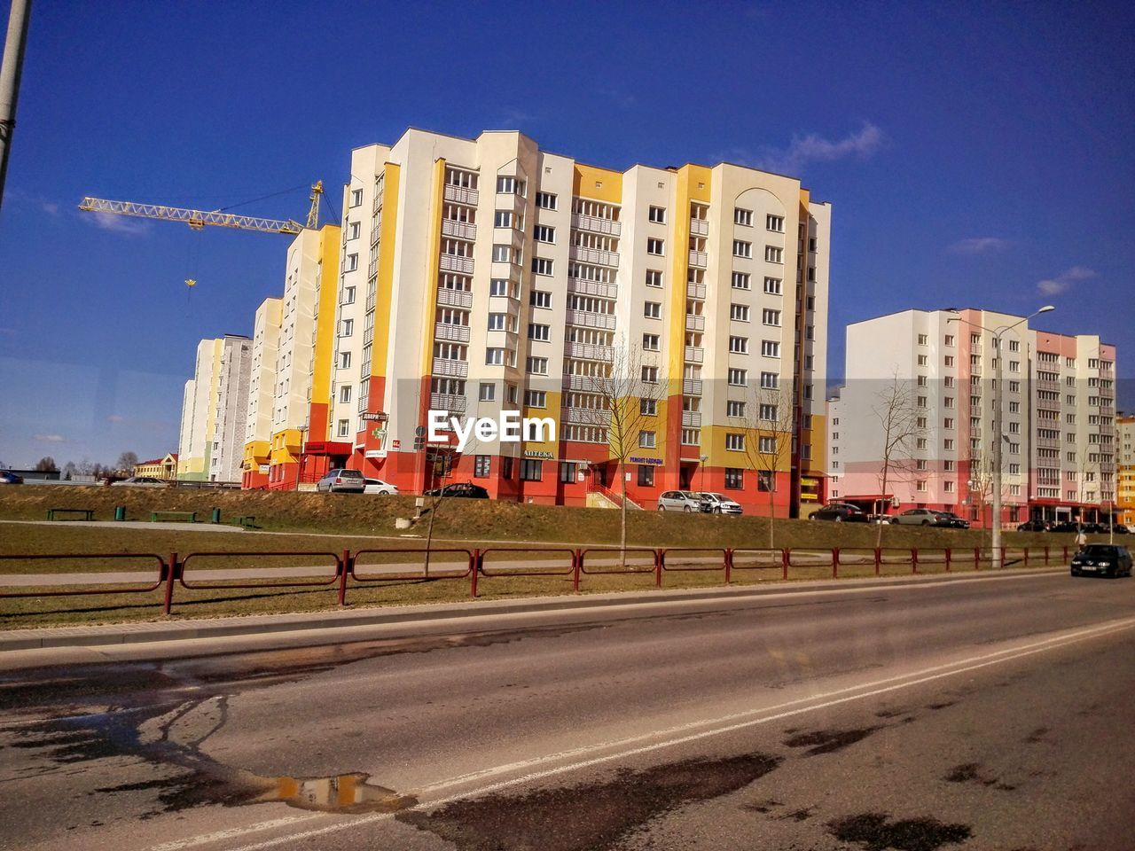 VIEW OF BUILDINGS ALONG ROAD