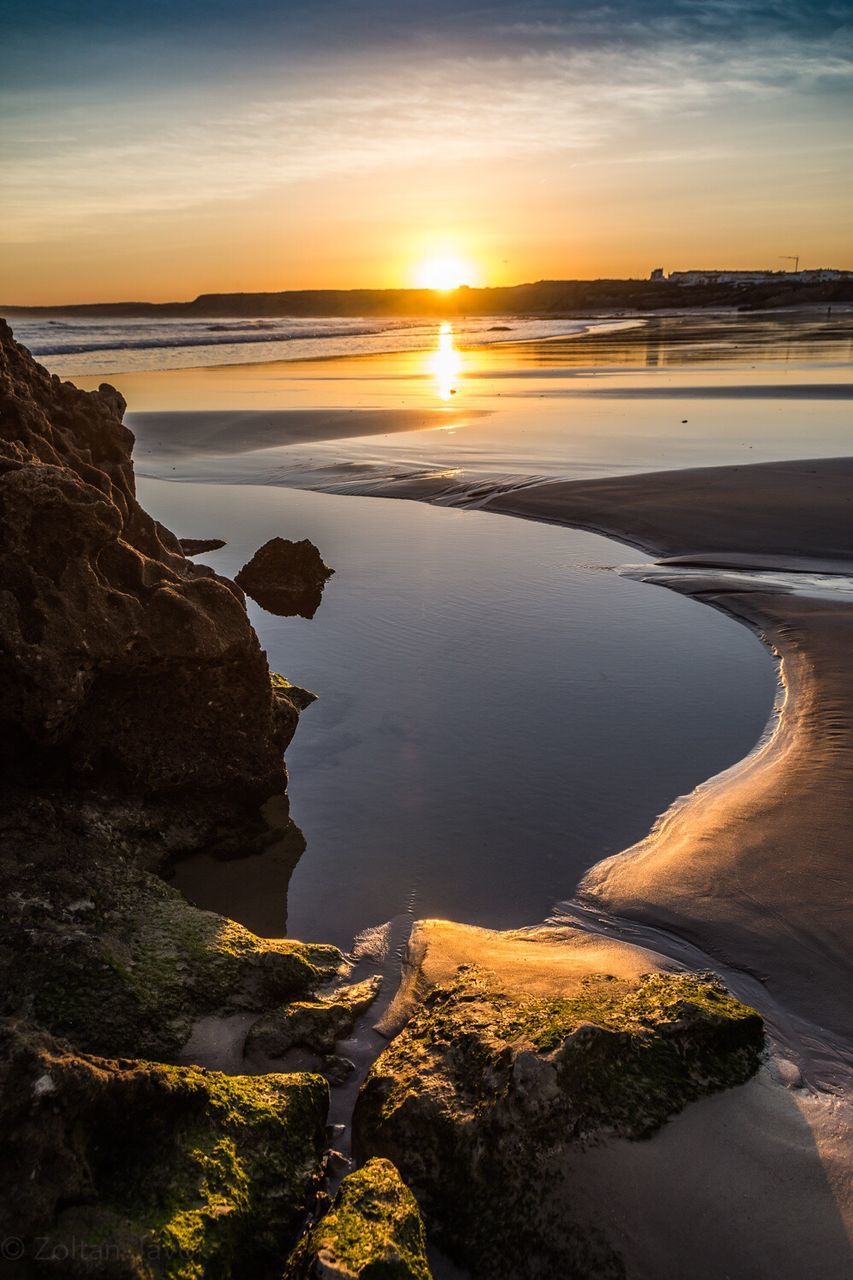 Scenic view of beach during sunset