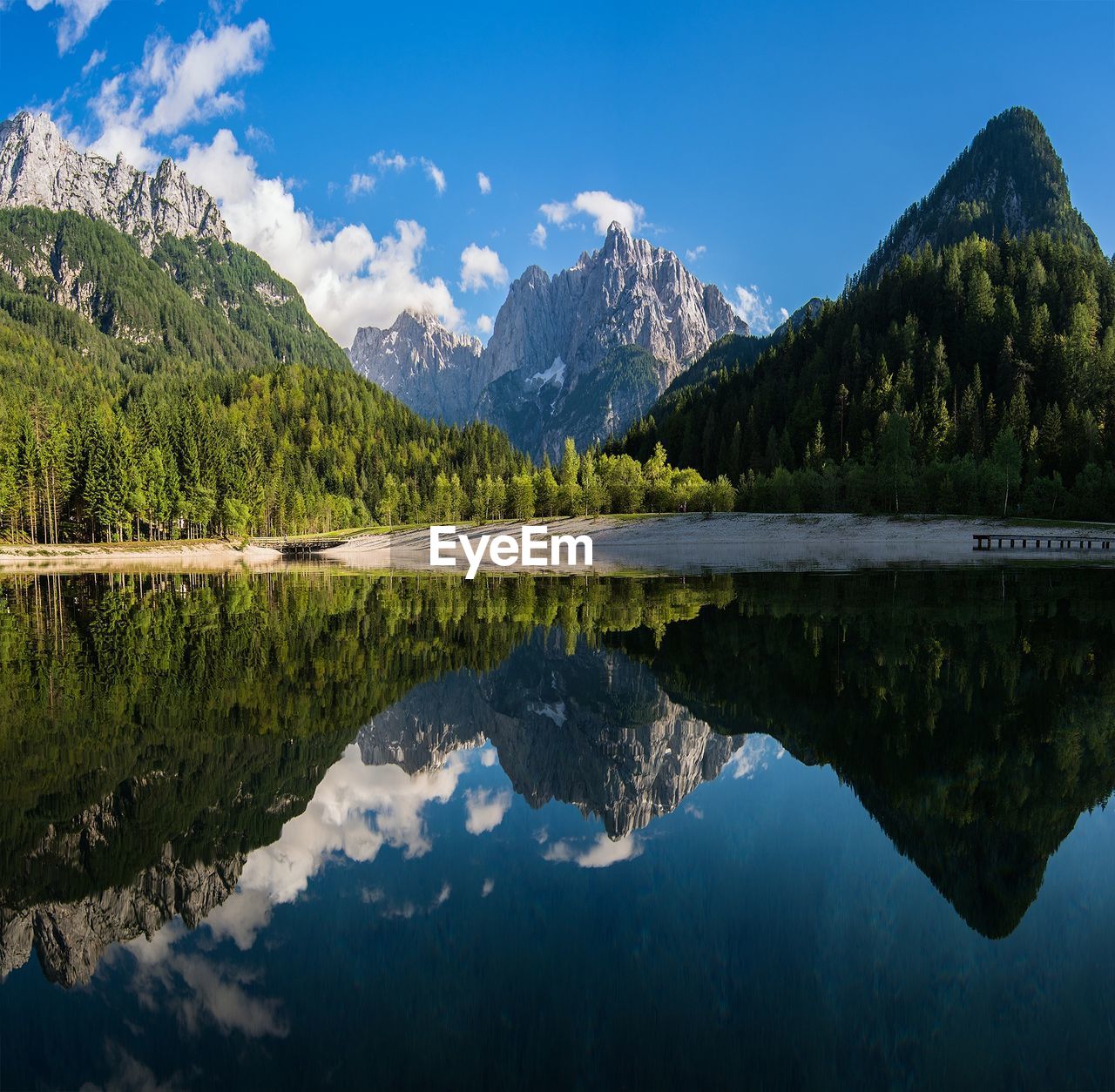 Scenic view of mountains reflecting on calm lake