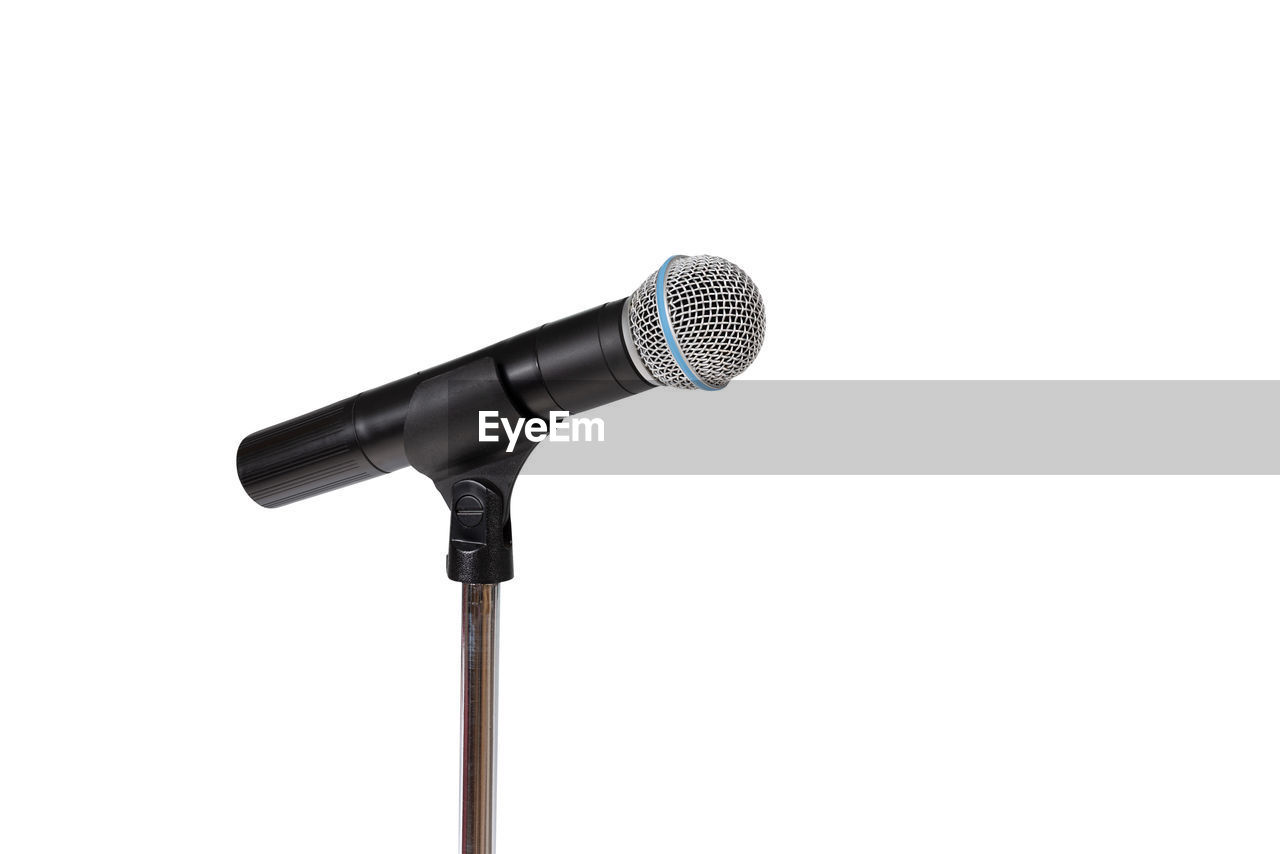 Close-up of microphone against white background