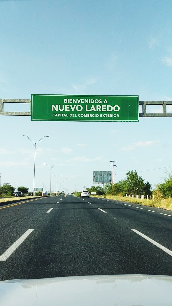 ROAD SIGNS AGAINST SKY