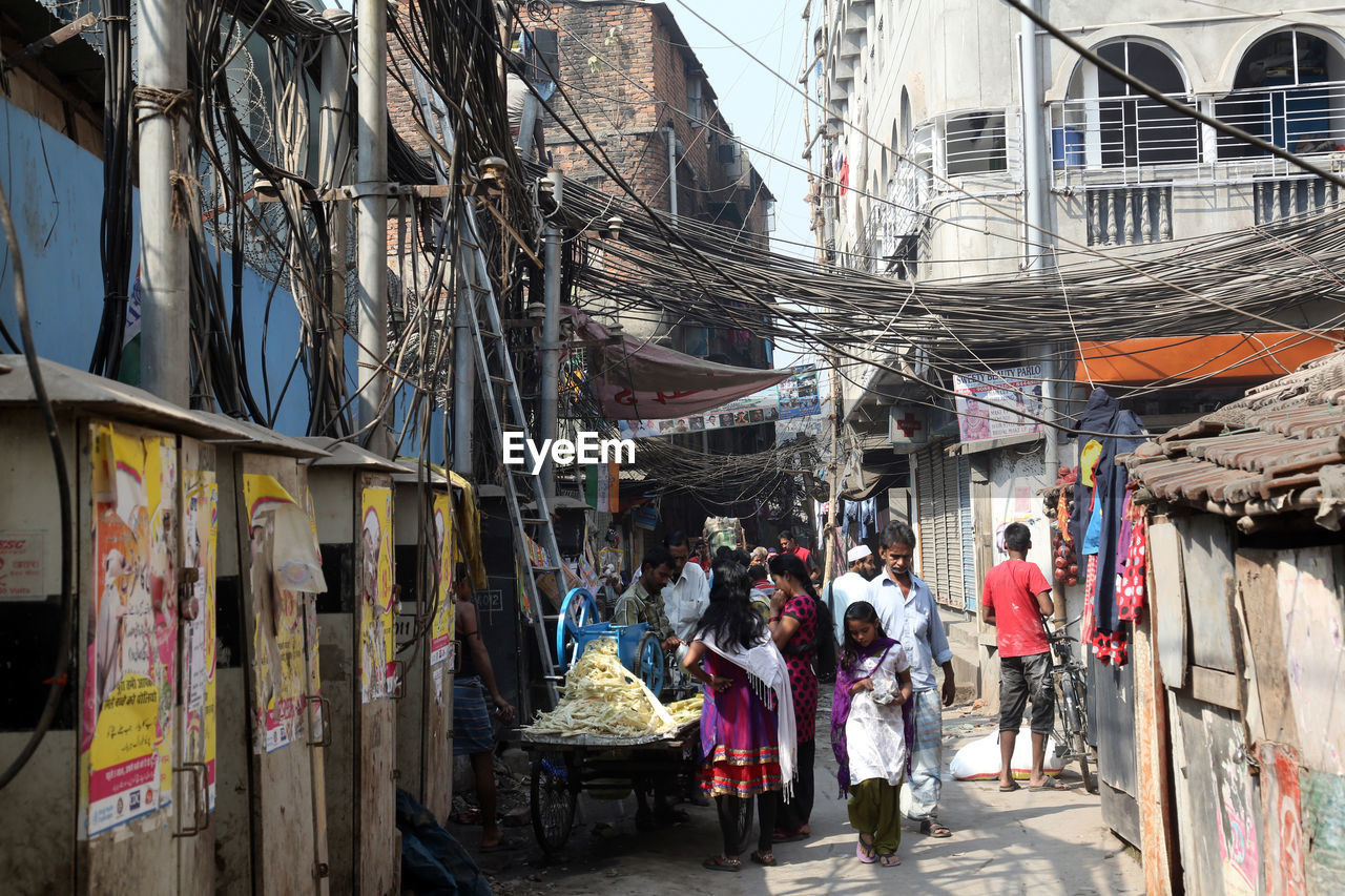 GROUP OF PEOPLE IN STREET MARKET