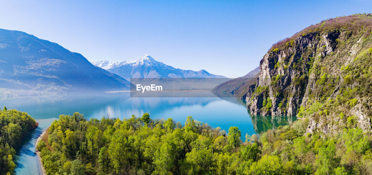 PANORAMIC VIEW OF LAKE AND MOUNTAINS AGAINST SKY