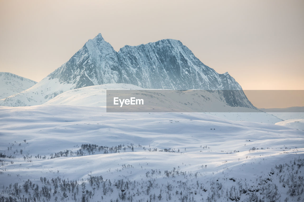 Scenic view of snow covered mountains