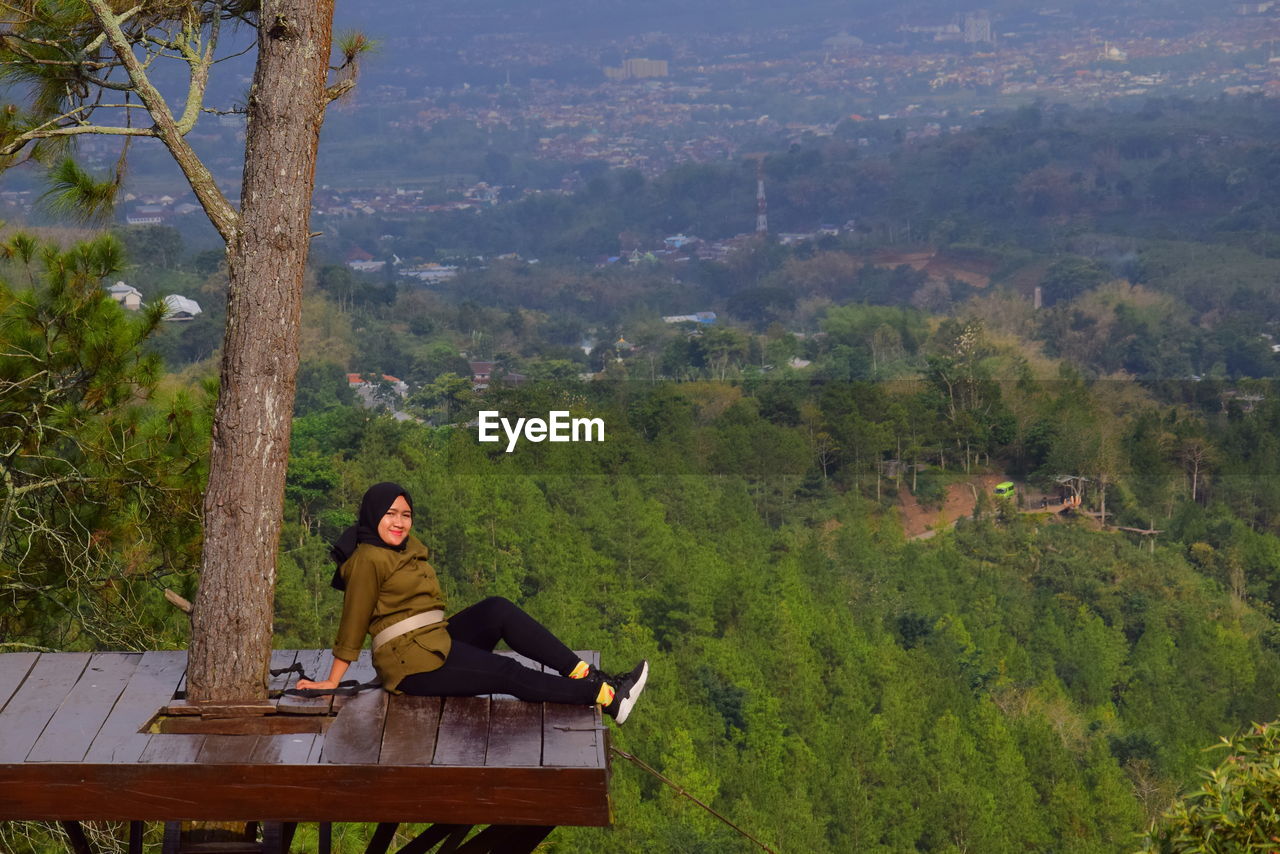 Woman siting on observation point