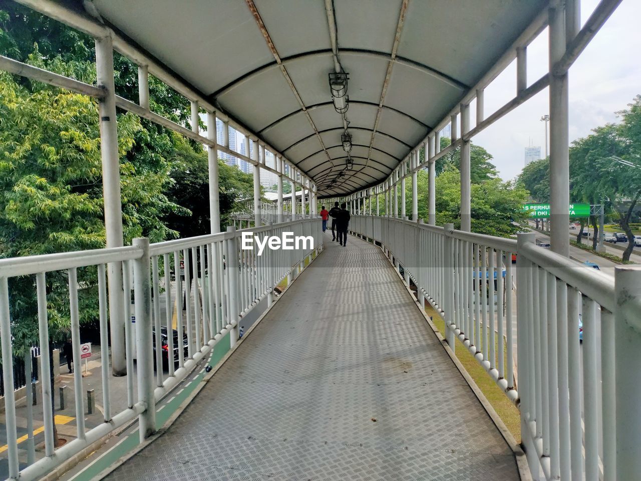 People walking on footbridge