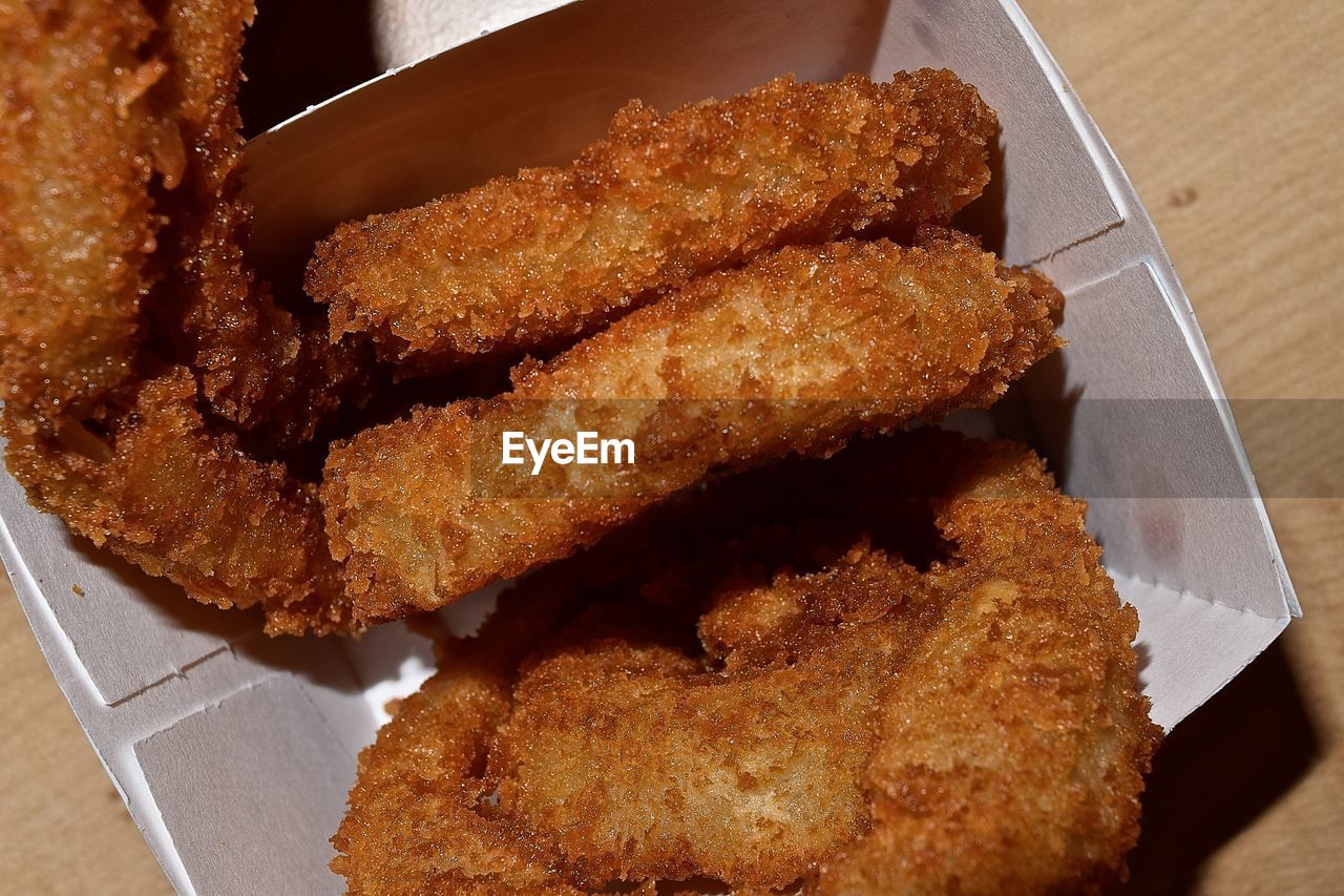 High angle view of fried food in box on table