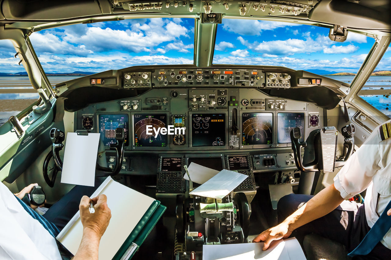 Pilots sitting in cockpit