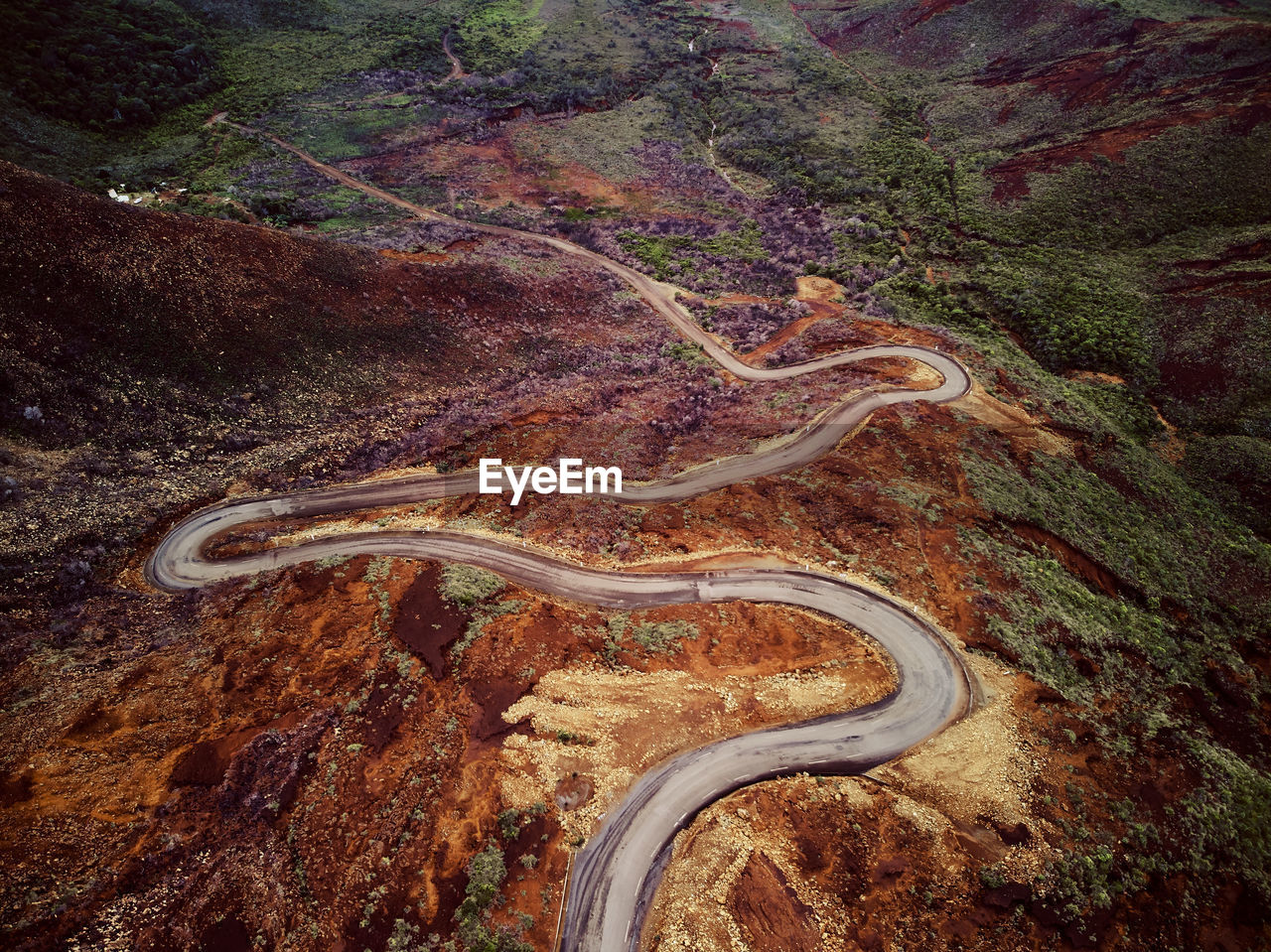 High angle view of winding road on land