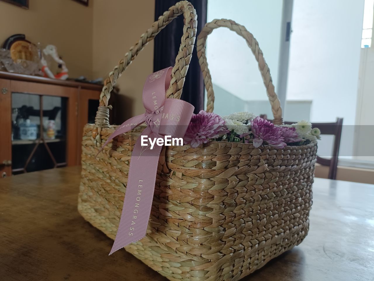 indoors, handbag, home interior, no people, pink, basket, flooring, domestic room, picnic basket, craft, container, hardwood floor, decoration, table, window, bag, art