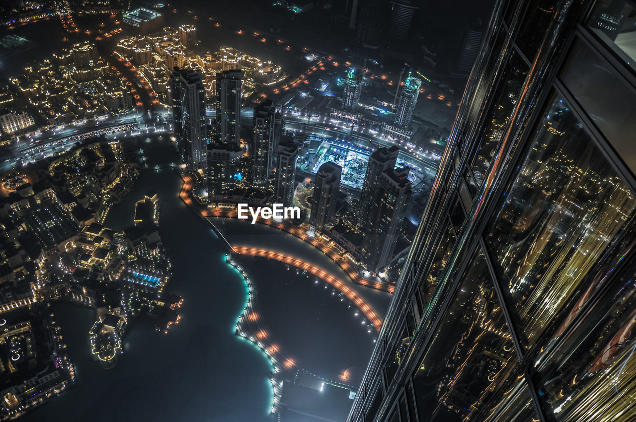 Illuminated modern cityscape seen from burj khalifa at night