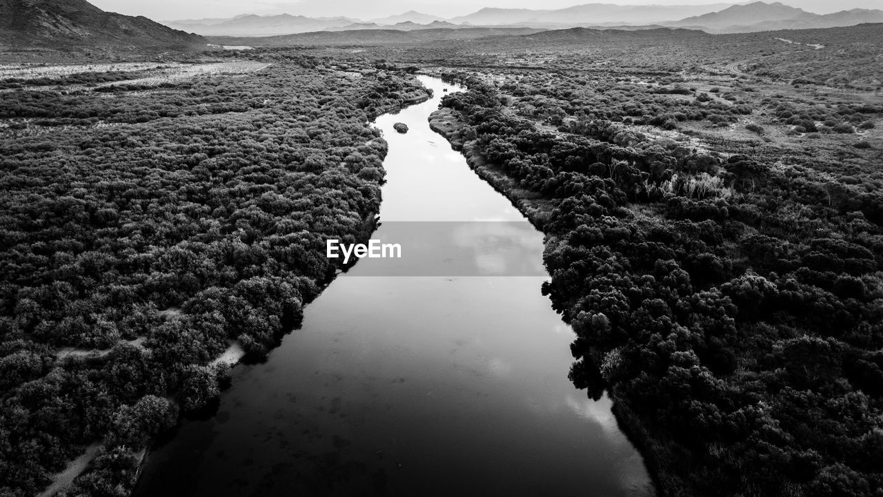 black and white, water, monochrome photography, monochrome, nature, environment, scenics - nature, landscape, coast, sea, sky, beauty in nature, mountain, reflection, land, tranquility, horizon, no people, travel destinations, rock, day, outdoors, non-urban scene, travel, aerial photography, tranquil scene, cloud, black, mountain range