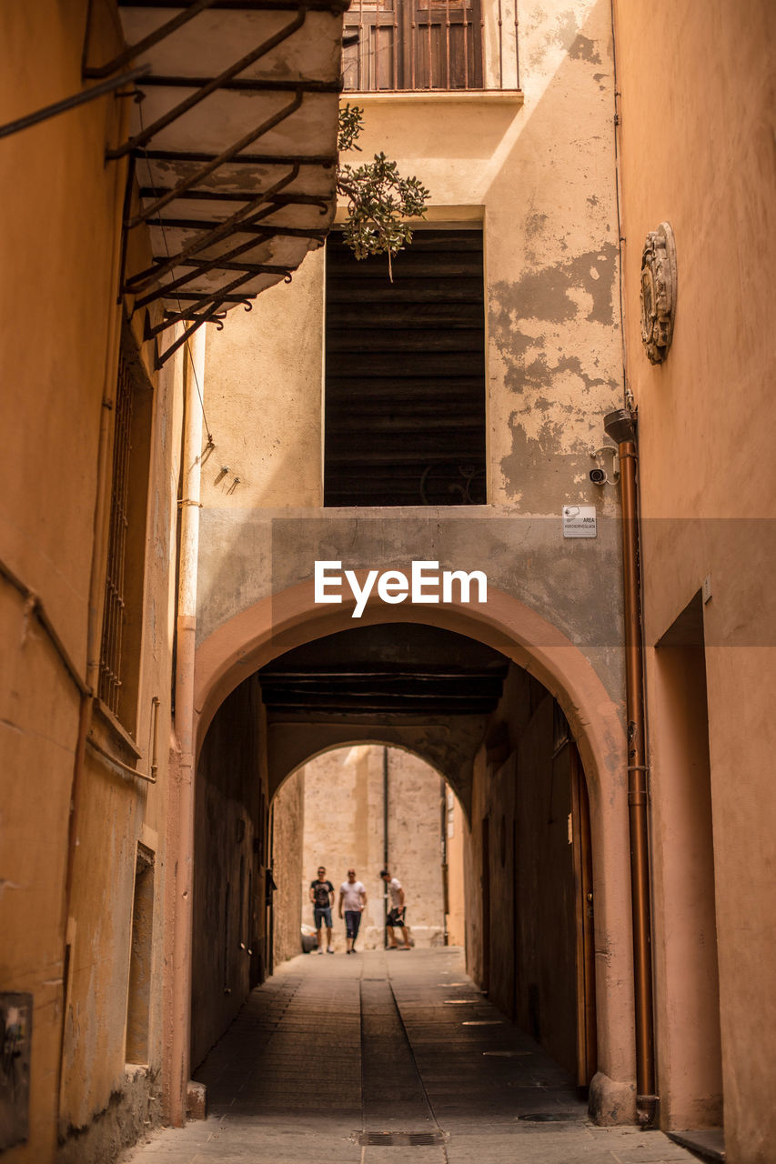 ALLEY AMIDST BUILDINGS