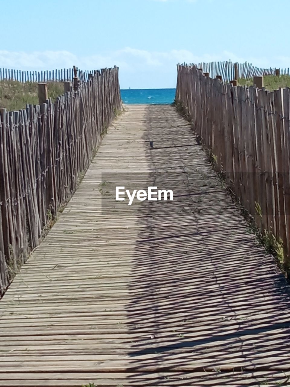 VIEW OF WOODEN PIER ON SEA