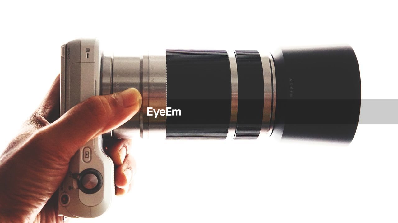 CLOSE-UP OF HAND PHOTOGRAPHING CAMERA