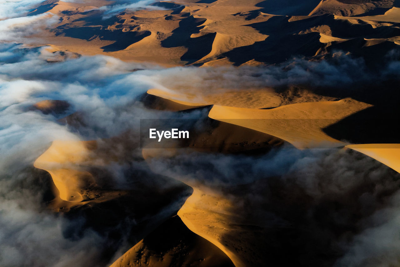 Aerial view of volcanic landscape against sky