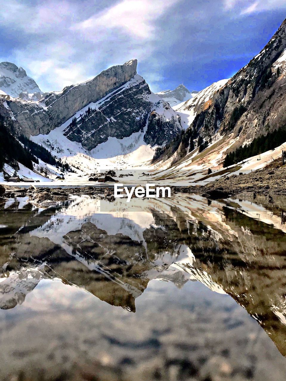 Reflection of snowcapped mountains on lake