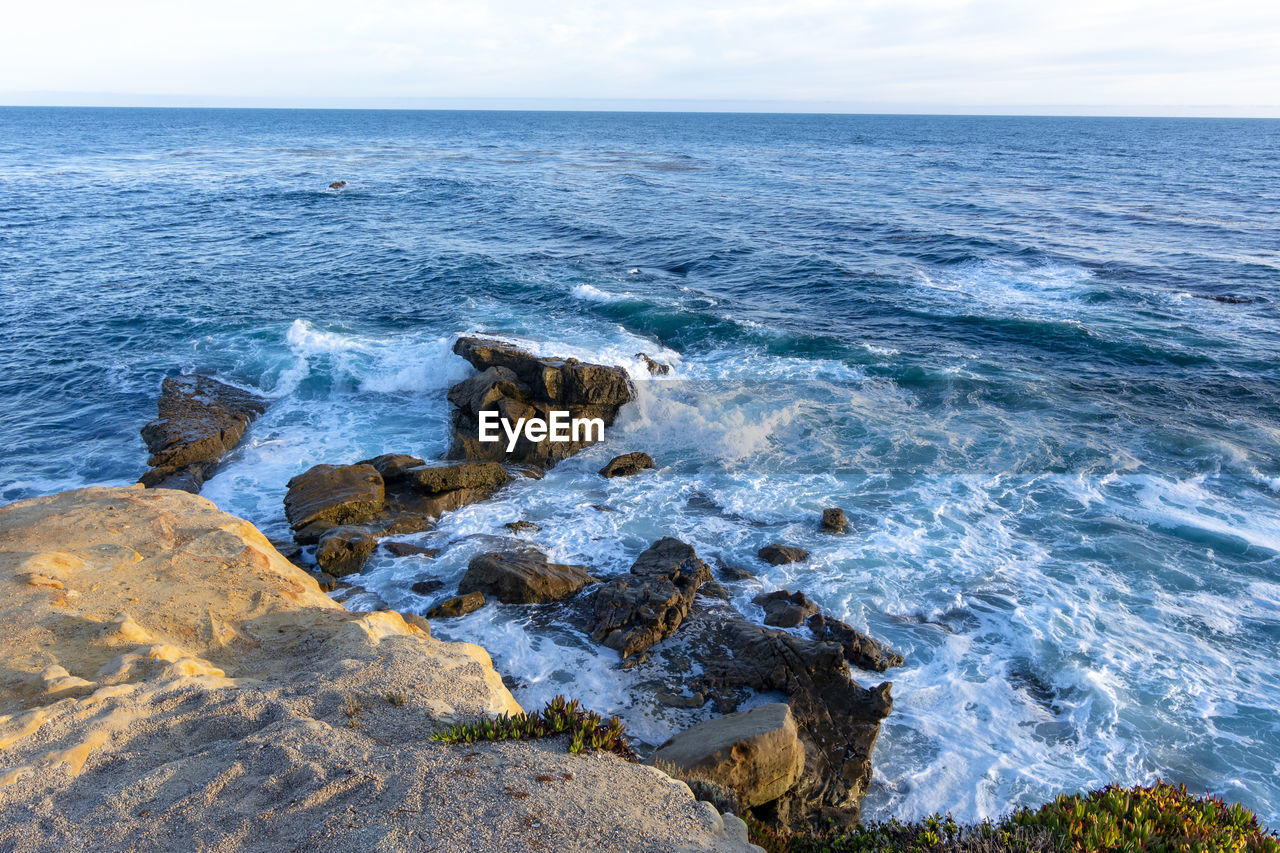 SCENIC VIEW OF ROCKS IN SEA