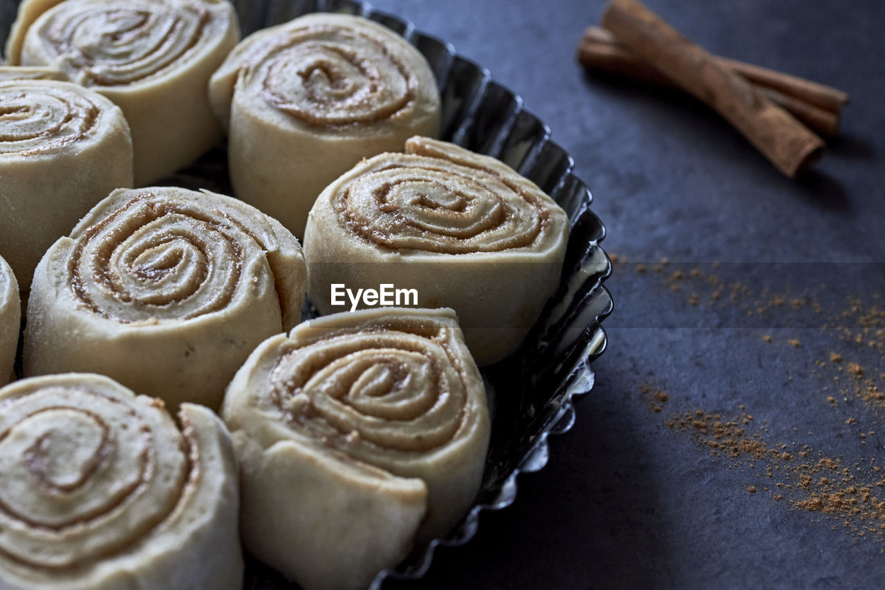 dessert, food and drink, food, sweet food, sweet, baked, freshness, icing, no people, indoors, still life, high angle view, close-up, cake, temptation, cinnamon roll, snack