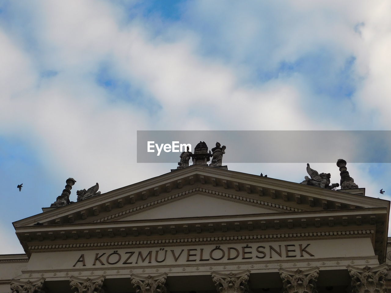 High section of built structure against clouds