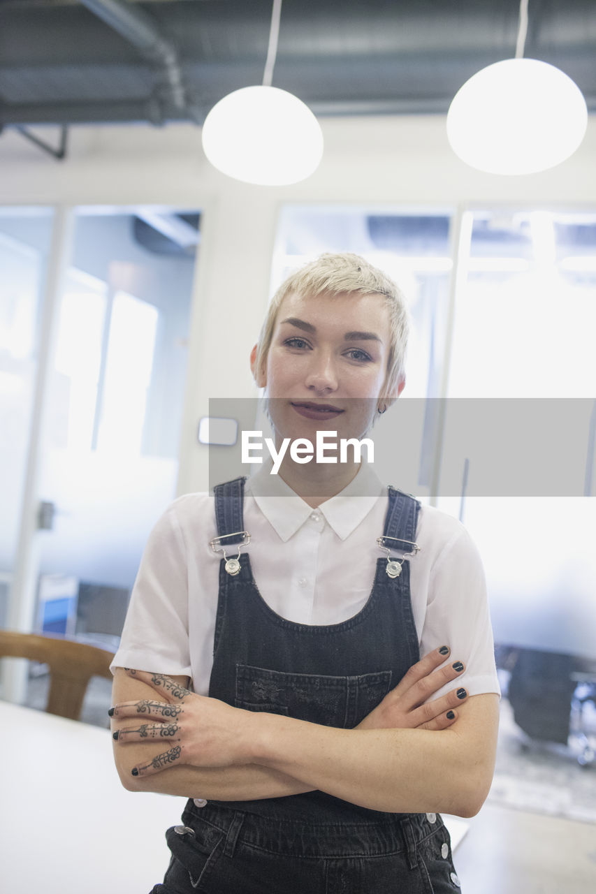 Professional young woman looking at camera.