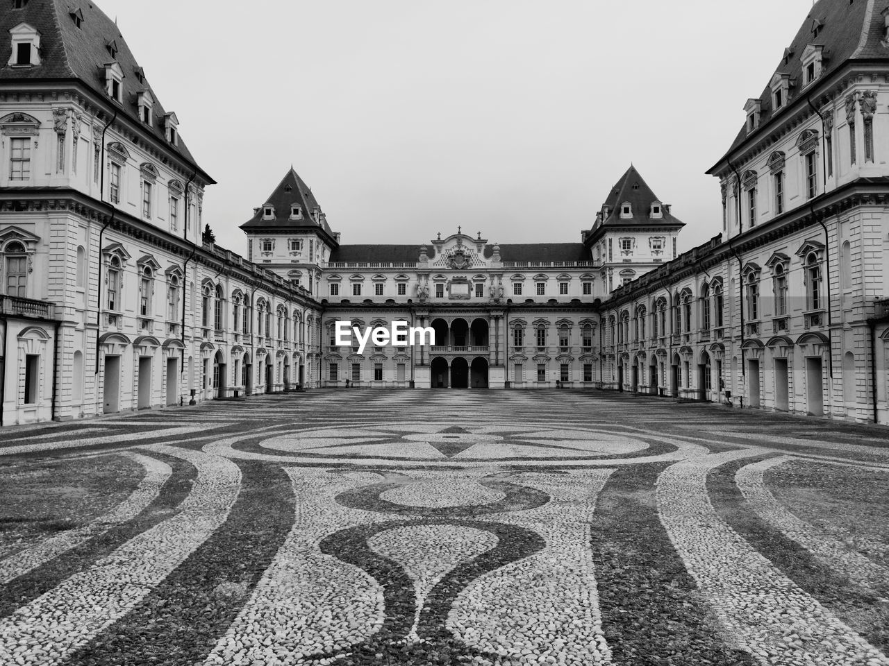 architecture, built structure, building exterior, black and white, monochrome, building, sky, travel destinations, the past, history, city, monochrome photography, street, nature, no people, road, urban area, clear sky, tourism, estate, travel, day, landmark, house, outdoors, facade, mansion, palace, cityscape, residential area