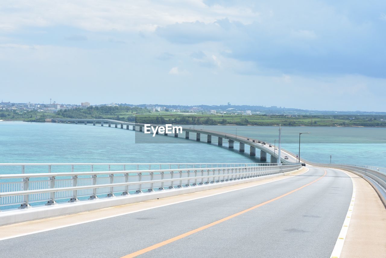 Road by sea against sky