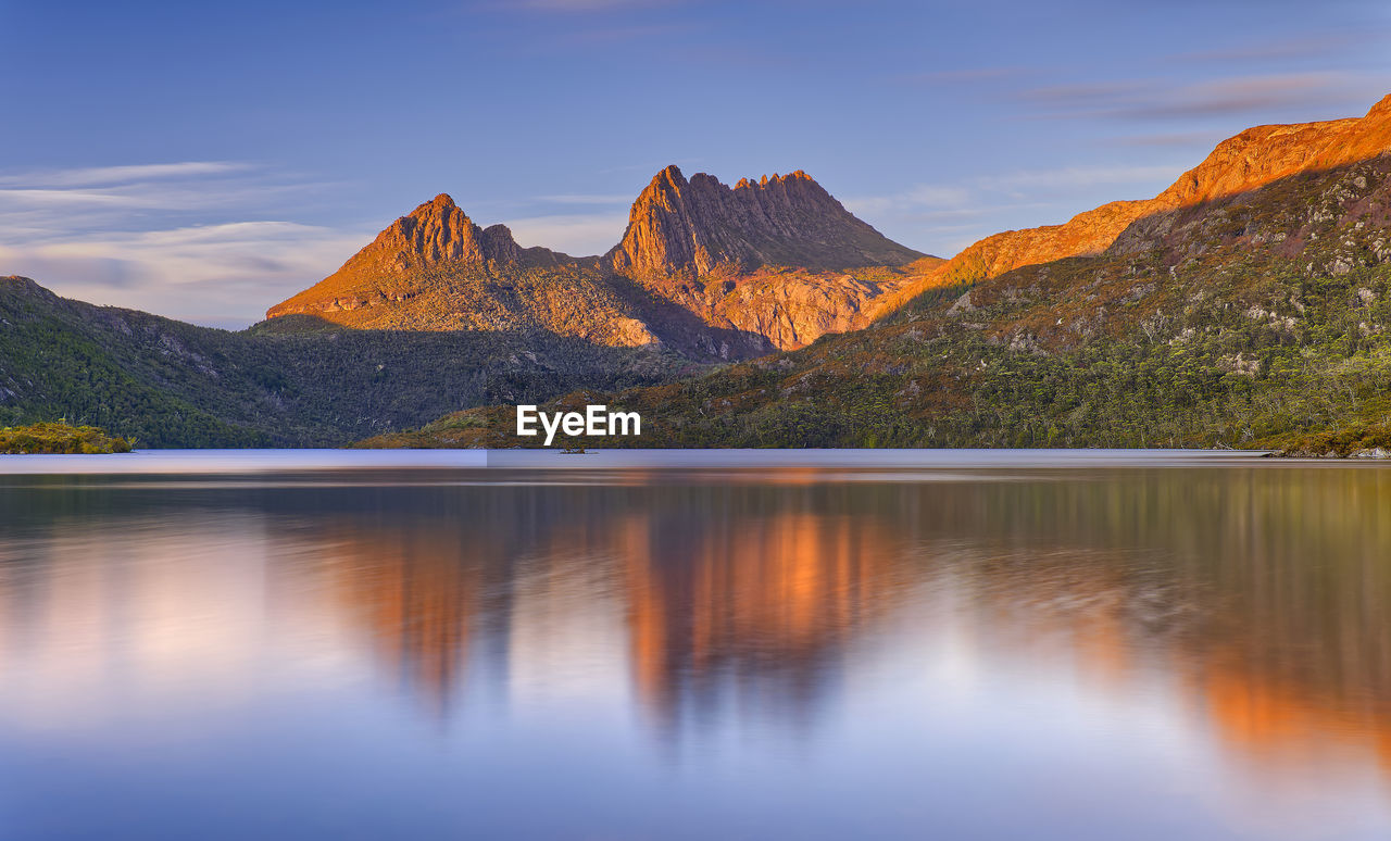 scenic view of lake against sky during sunset