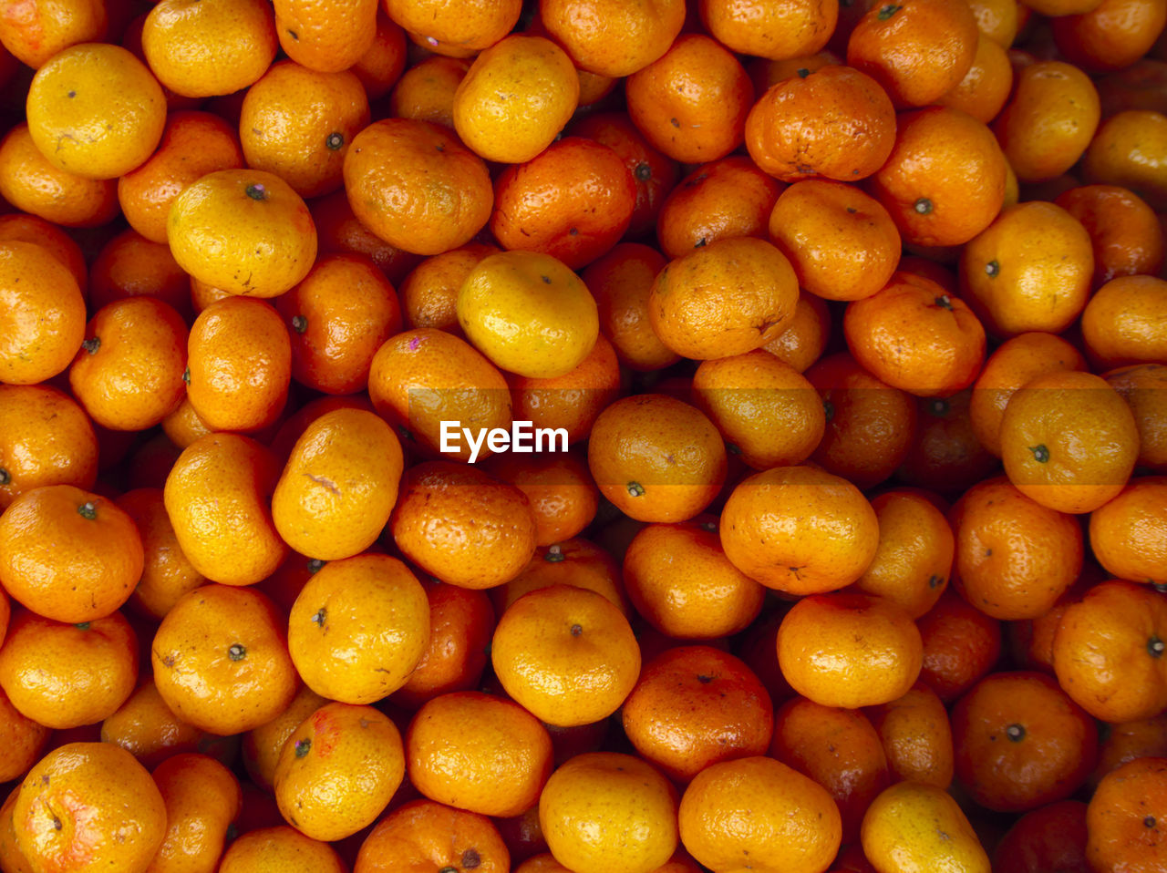 Full frame shot of oranges at market stall