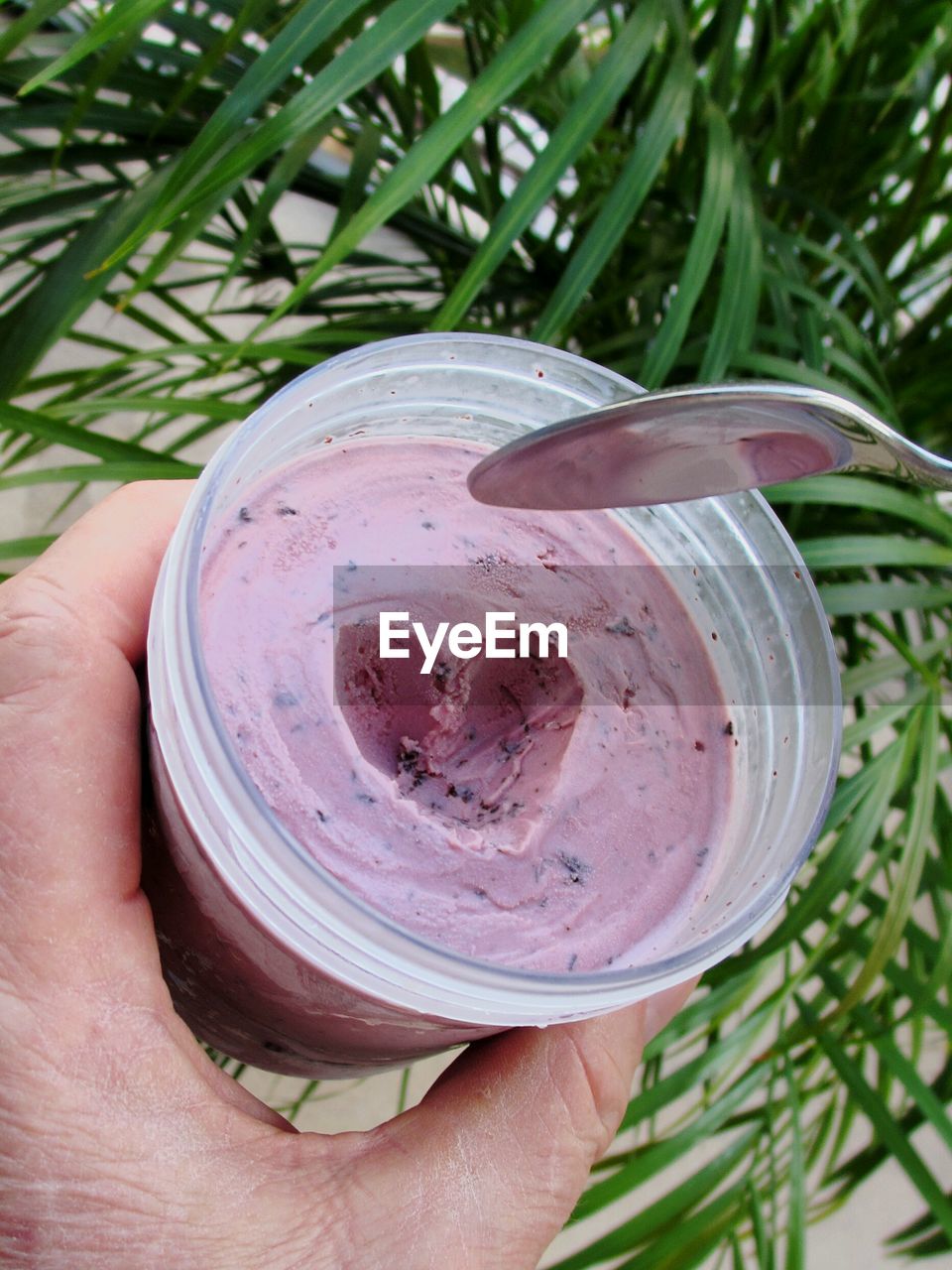 Cropped hand of woman holding ice cream