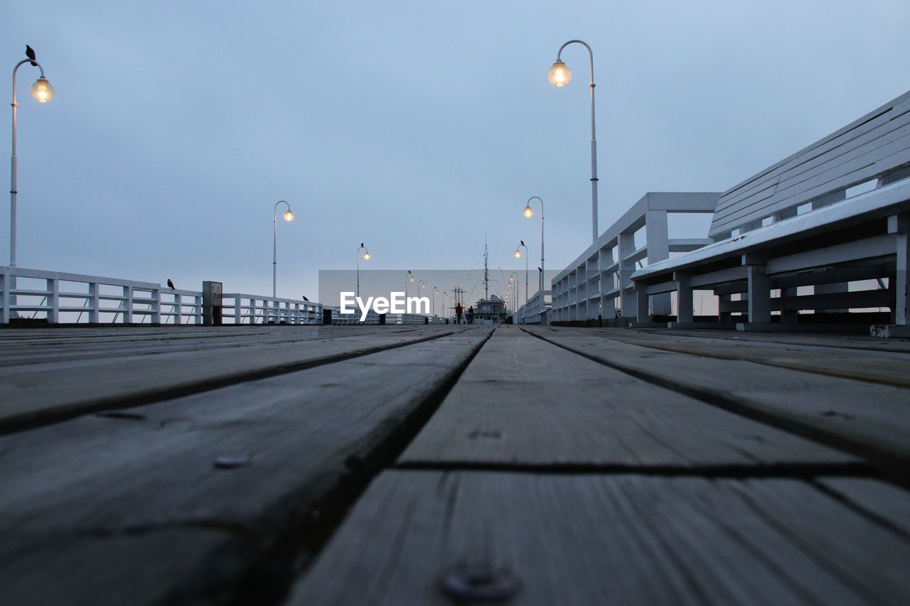 SURFACE LEVEL OF STREET LIGHTS AGAINST SKY