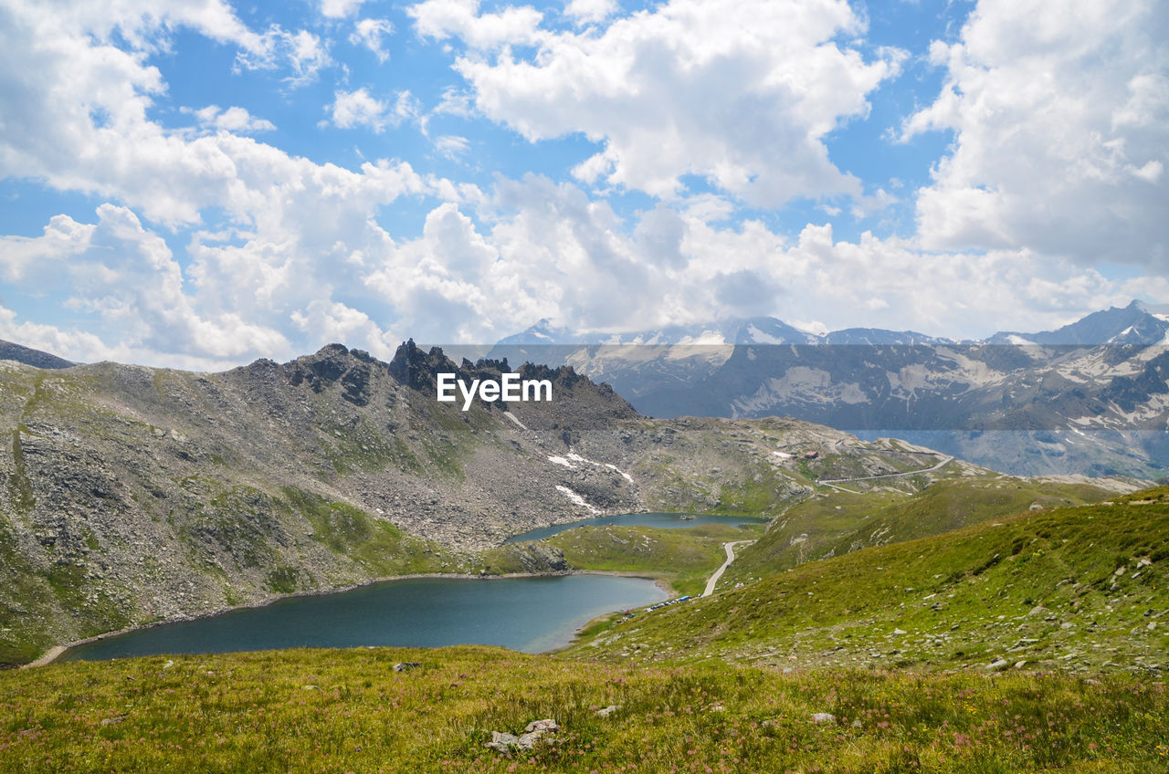 Scenic view of landscape and mountains against sky