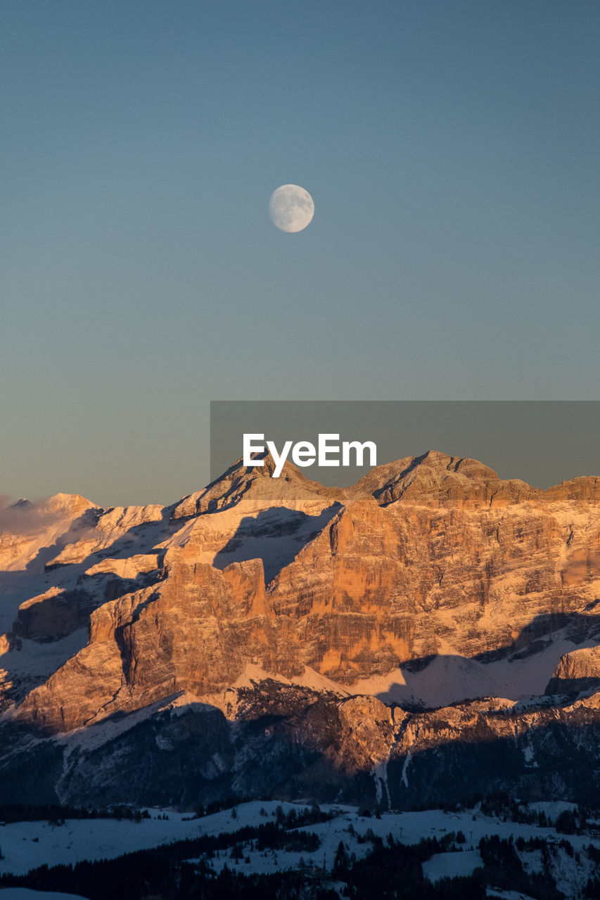 Scenic view of mountains against clear sky during winter