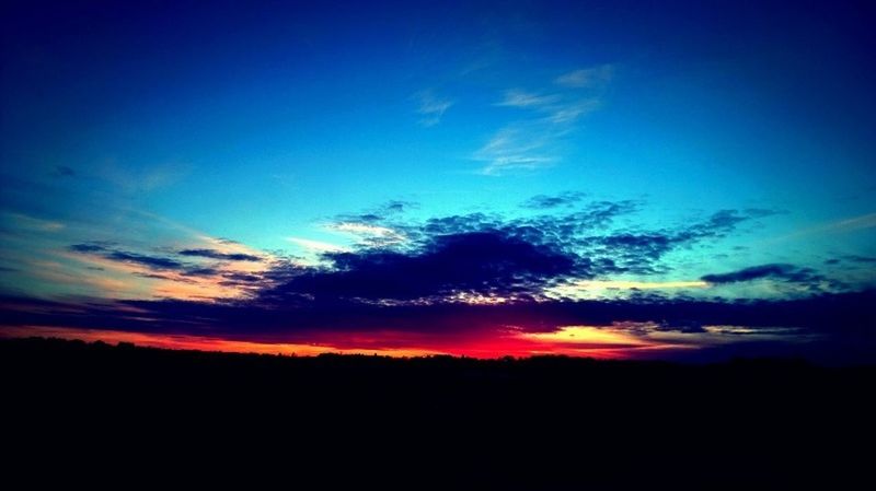 SILHOUETTE OF LANDSCAPE AGAINST SKY AT SUNSET