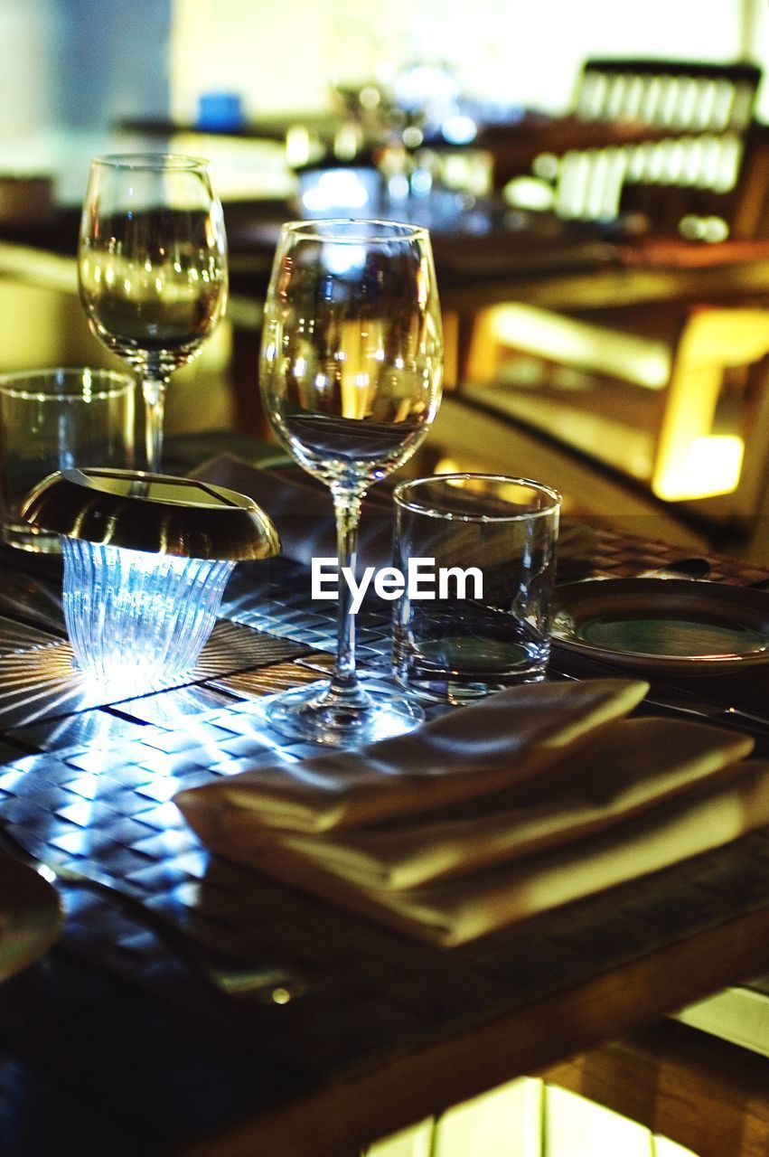 Drinking glasses on table at restaurant