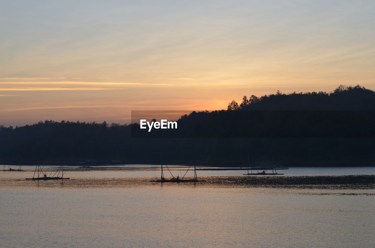 SCENIC VIEW OF BEACH DURING SUNSET