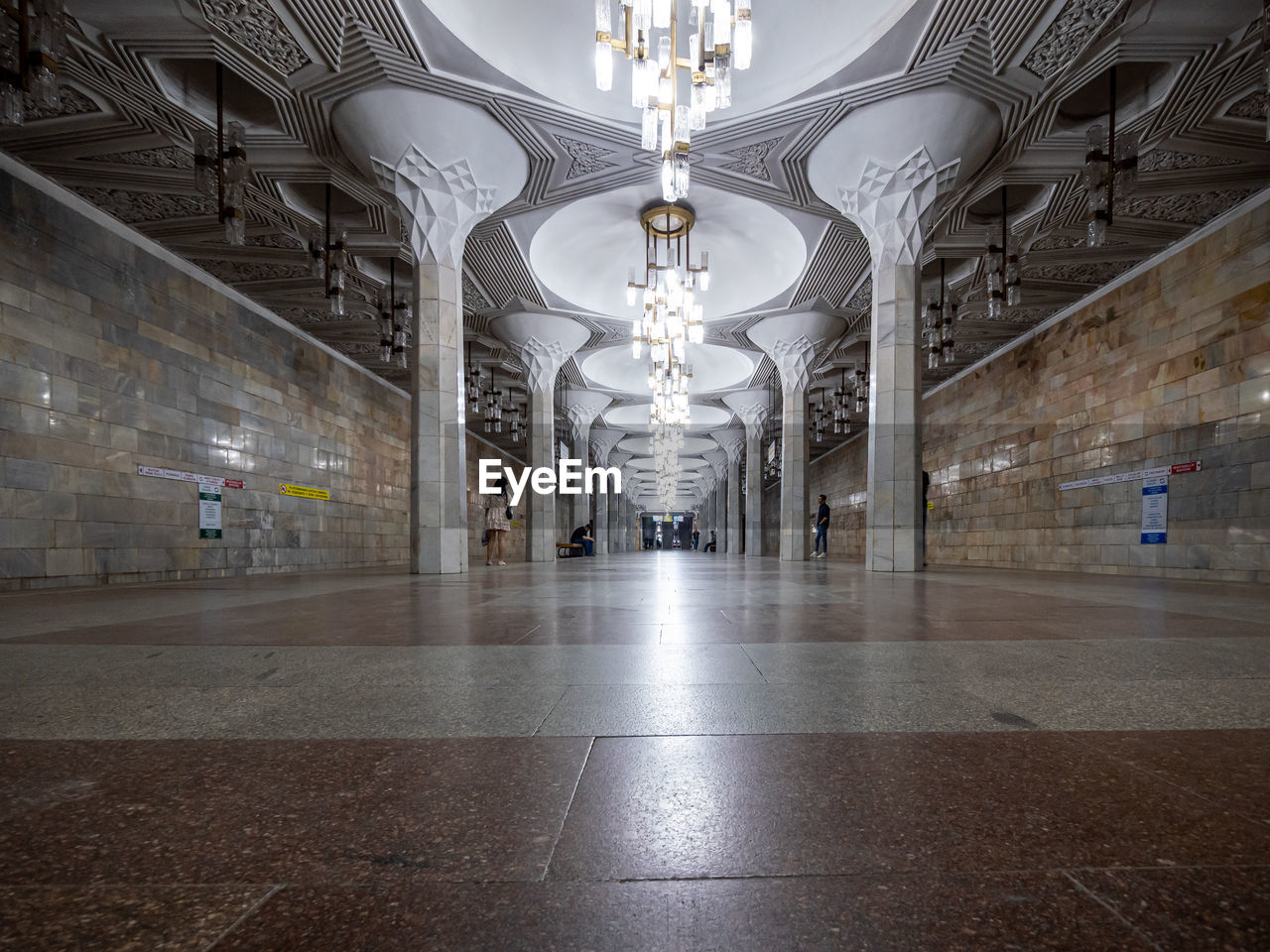 architecture, built structure, indoors, lighting equipment, building, ceiling, travel destinations, hall, flooring, travel, history, the past, city, no people, light, arch, illuminated, architectural column, tourism, corridor, transportation, arcade