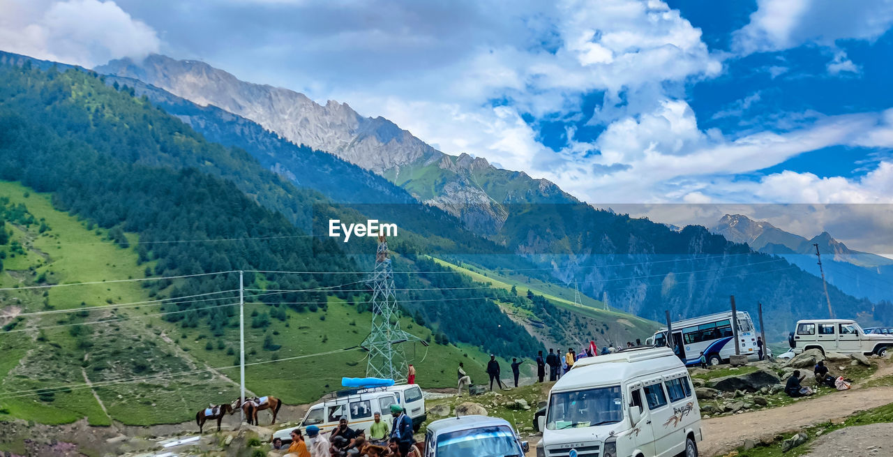 PANORAMIC VIEW OF MOUNTAIN RANGE AGAINST SKY