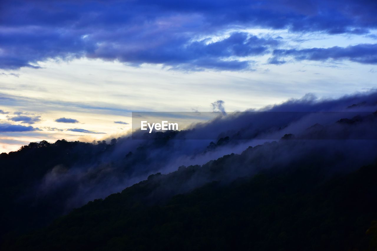 Low angle view of dramatic sky during sunset