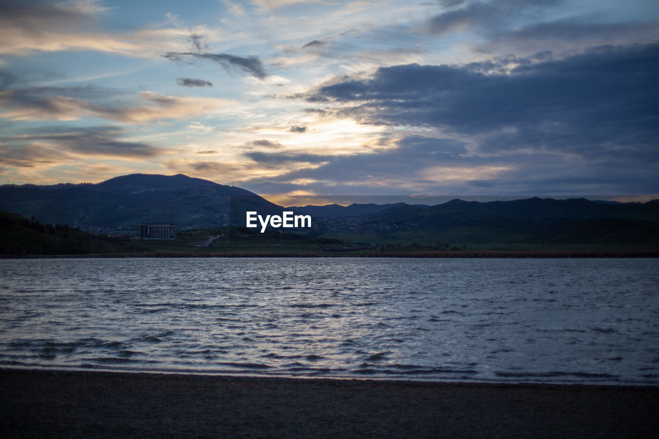 SCENIC VIEW OF LAKE DURING SUNSET