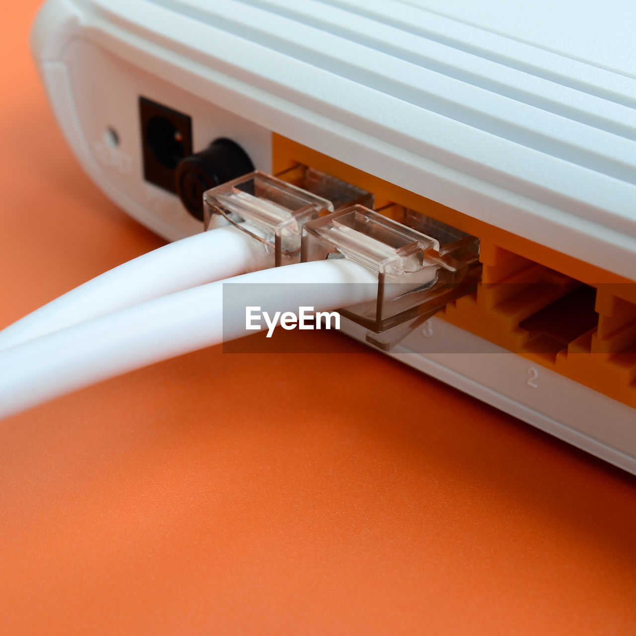 Close-up of computer network cables in router on table