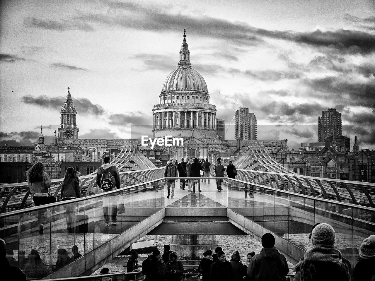 People on london millennium footbridge against st paul cathedral in city