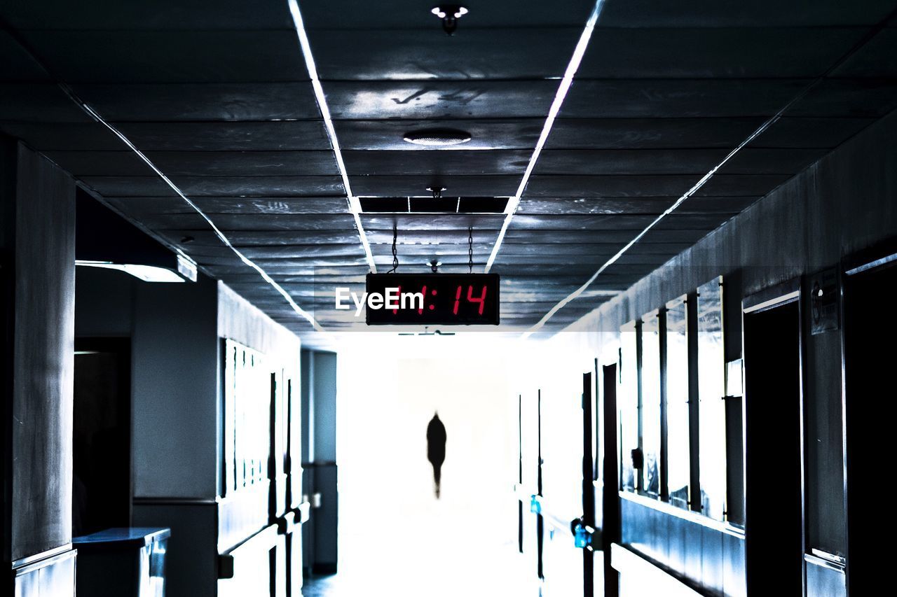 Digital clock hanging from ceiling at hospital