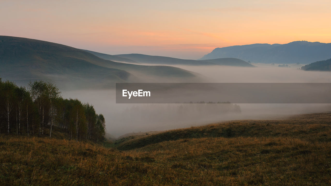 Scenic view of mountains against sky during sunset