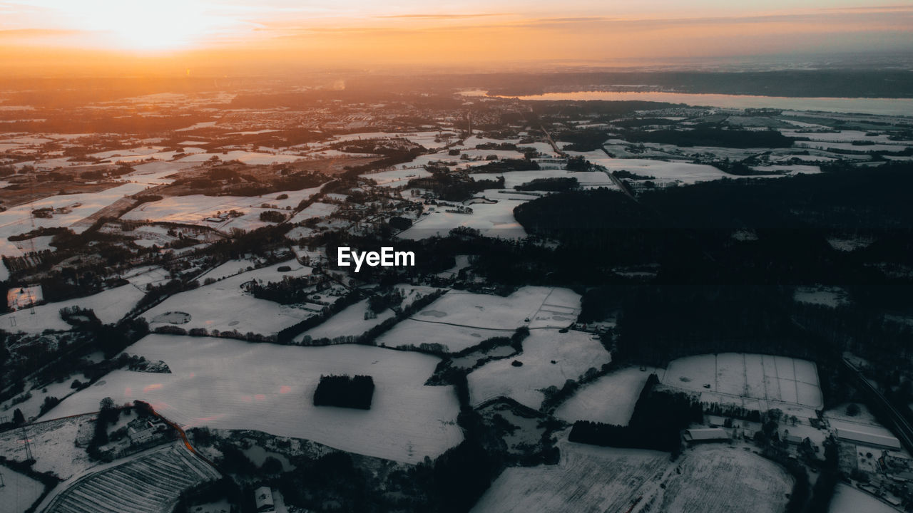 HIGH ANGLE VIEW OF BUILDINGS DURING WINTER