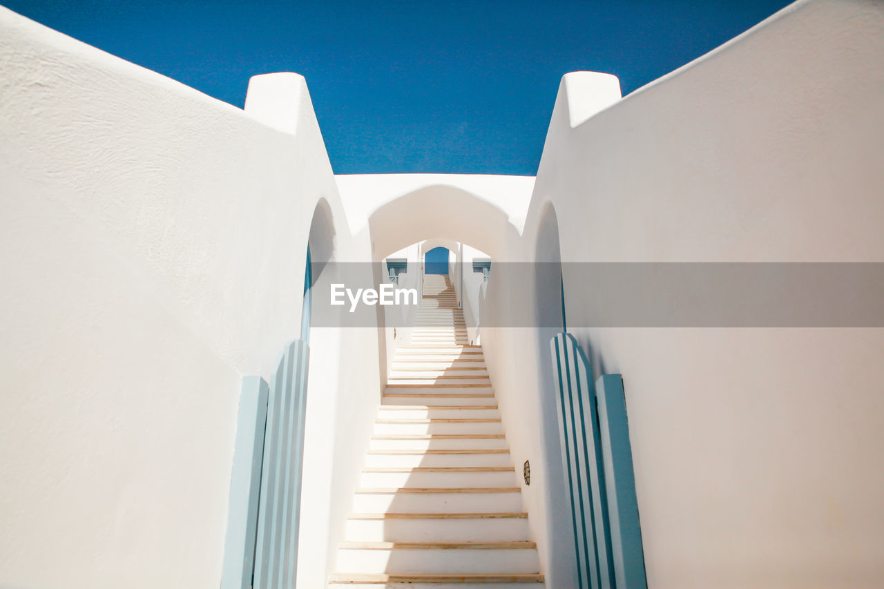 Low angle view of whitewashed stairway at santorini